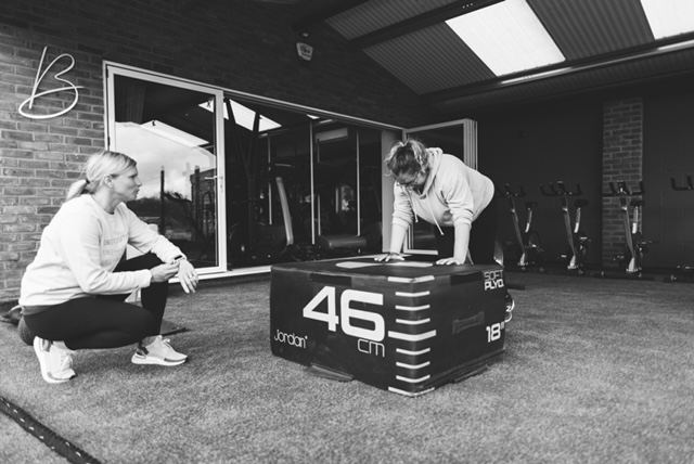 Jo coaching box jumps on the turf