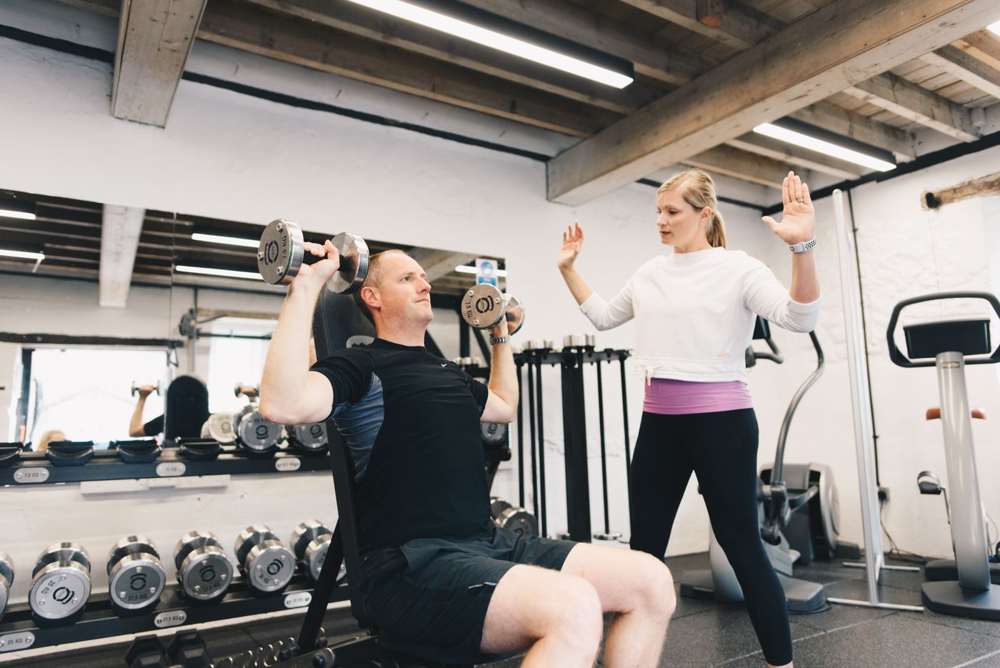 Jo coaching a shoulder press
