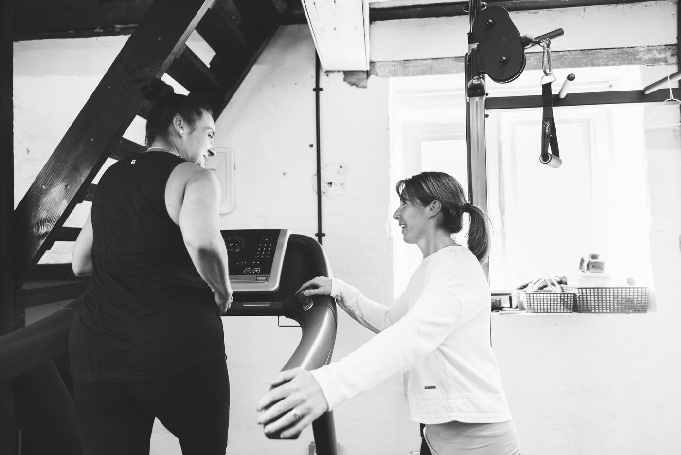 Pam coaching a client on the treadmill