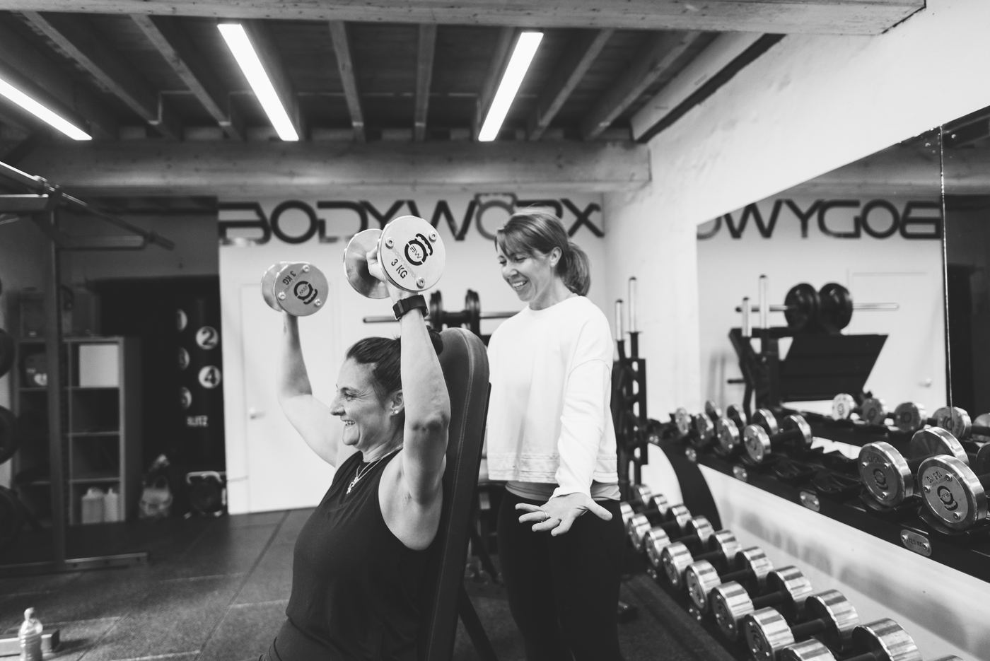 Pam coaching a shoulder press